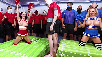 Cheerleaders warm up football players with a blowbang before the gangbang