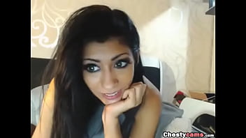 Cute brunette talking on webcam showing her tits