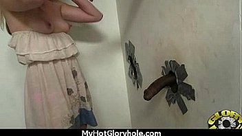 Ebony sucks off a big cock through a gloryhole 24