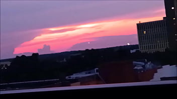 2 lovely ladies fuck a guy on the balcony and get their faces covered in cum