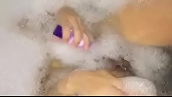Playing with my pussy in the bath dildo