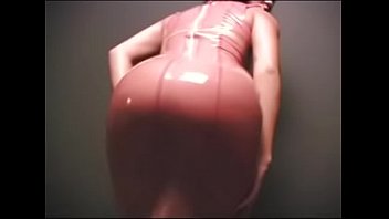 Rubbing her pussy in a rubber outfit