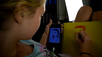 Cute teen porn star drawing a picture while sitting on a bed before she gets used sexually