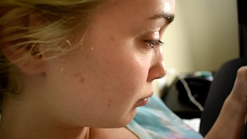 Cute teen porn star drawing a picture while sitting on a bed before she gets used sexually