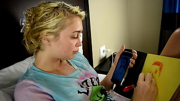 Cute teen porn star drawing a picture while sitting on a bed before she gets used sexually