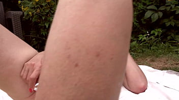 Nympho mature masturbating outdoor