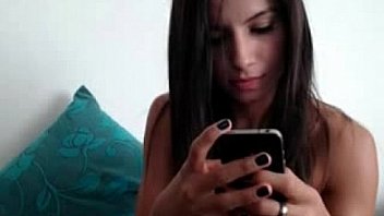 Busty brunette rubs clit on webcam