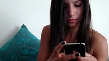 Busty brunette rubs clit on webcam