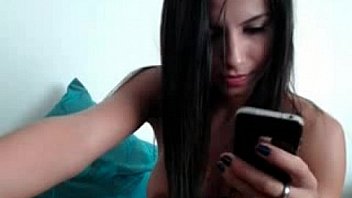 Busty brunette rubs clit on webcam