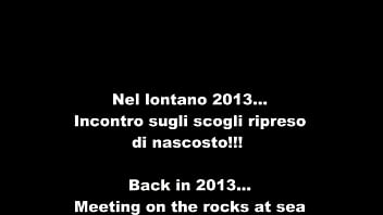 Stranger on rocks at the sea