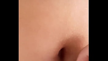 I stop to admire her navel