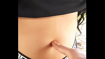 I stop to admire her navel