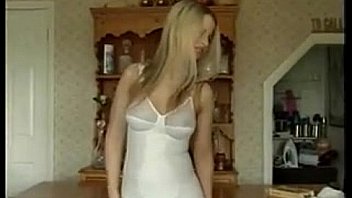 Busty blonde chick does a striptease