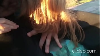 Giving a blowjob plain in daylight outdoors