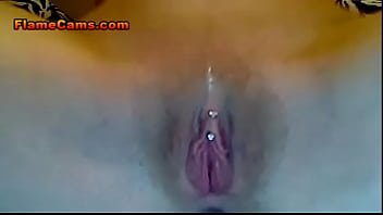 Tiny pierced teen fingers her wet pussy