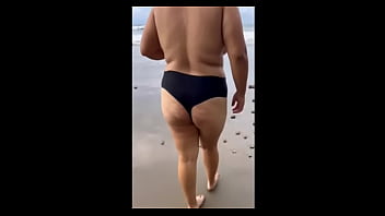 How nice chubby mexican girl strips naked on the beach