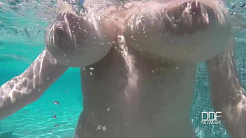 Natural Tits Superstar Teases With Cleavage In Pool thumbnail