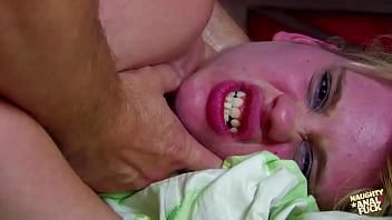 Observing the performance of a voluptuous blonde woman undressing on a webcam ultimately results in very explicit sexual activities including the insertion of a fist and engaging in intense anal intercourse