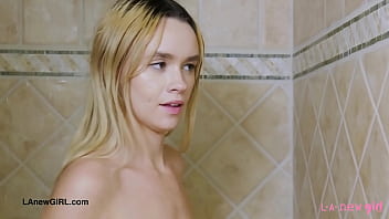Sunny blonde teen enjoys a sensual bath