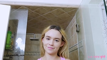 Sunny blonde teen enjoys a sensual bath