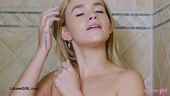 Sunny blonde teen enjoys a sensual bath