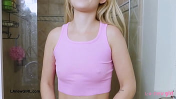 Sunny blonde teen enjoys a sensual bath