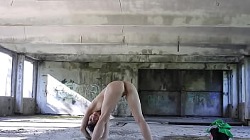 Flexible Brunette Naked Doing Sports In An Abandoned House thumbnail