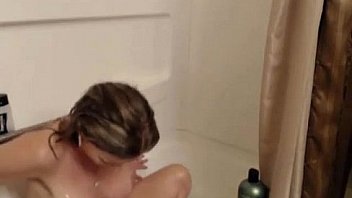 Babe masturbates in the shower on webcam