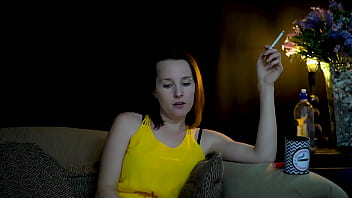 Sucking on a cigarette and looking at you