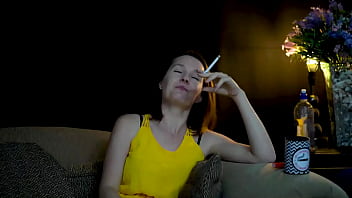 Sucking on a cigarette and looking at you