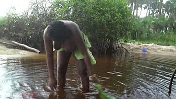 Busty african witch grinding her thick body in ritual dance and cleansing in sacred water