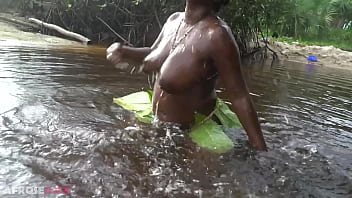 Busty african witch grinding her thick body in ritual dance and cleansing in sacred water