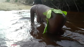 Busty african witch grinding her thick body in ritual dance and cleansing in sacred water