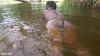 Busty african witch grinding her thick body in ritual dance and cleansing in sacred water