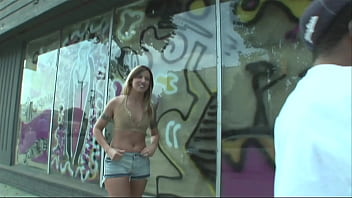 She's got a half sleeve on one arm a tribal band on the other and a thick cock shoved