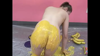 Busty chick pours her body with banana puree