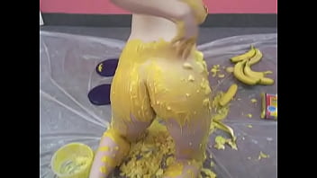 Busty chick pours her body with banana puree