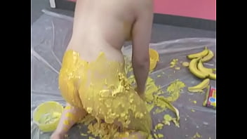 Busty chick pours her body with banana puree