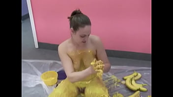 Busty chick pours her body with banana puree