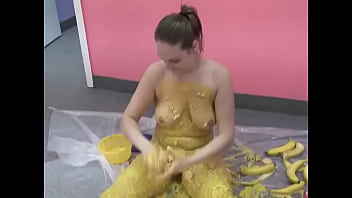 Busty chick pours her body with banana puree