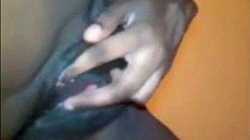 Busty black babe toys and fingers her pussy