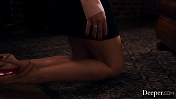 A cigar shop employee is at the service of an exacting customer