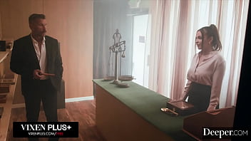 A cigar shop employee is at the service of an exacting customer