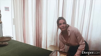 A cigar shop employee is at the service of an exacting customer A cigar shop employee is at the service of an exacting customer