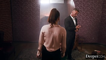 A cigar shop employee is at the service of an exacting customer