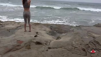 Girl meditates at by the oceans