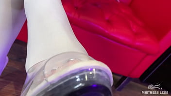 I sit on the couch in sexy white stockings and dangle my heels