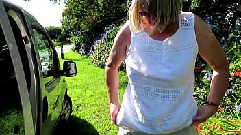 Swapping top beside car