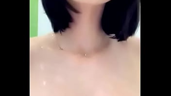 Tattooed babe gets wet and bubbly in the tub