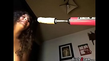 Brunette masturbates with a vibrator and a dildo machine